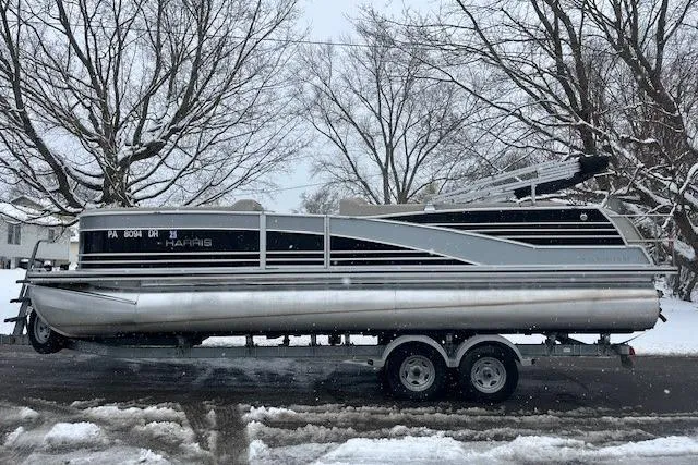 Slide: The Image of 2016 Harris Grand Mariner SEL 250 pontoon boat on trailer in snowy setting. - 2