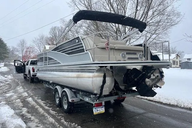 Slide: The Image of 2016 Harris Grand Mariner SEL 250 pontoon boat on trailer in snowy setting. - 3