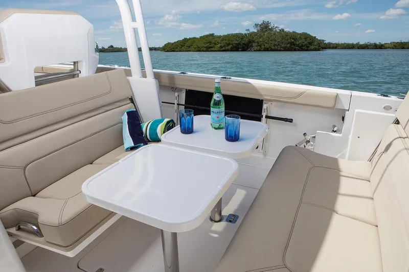 Slide: The Image of Manufacturer Provided Image: 2023 Pursuit S 328 Sport boat cruising on open water. - 21