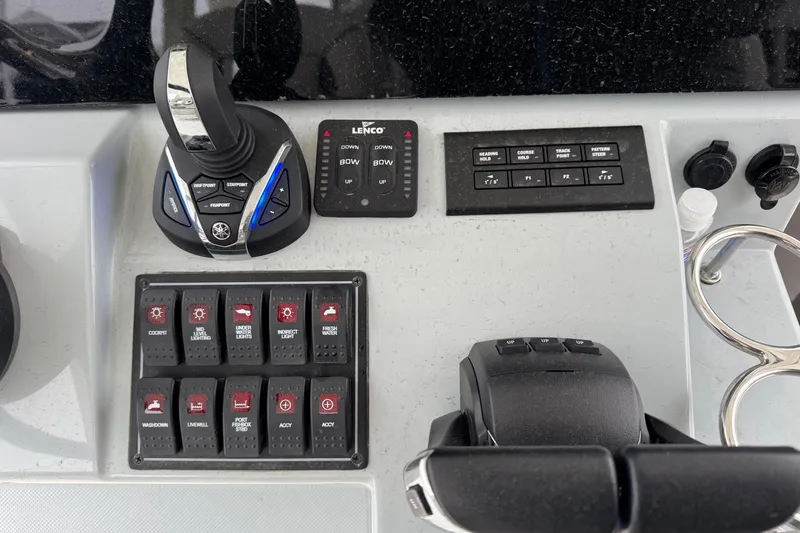 Slide: The Image of 2023 Pursuit S 328 Sport boat interior with cushioned seating and storage compartments. - 8