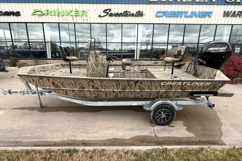 The Image of 2026 Crestliner 1870 Retriever FCC boat with camouflage design on a trailer. - 0