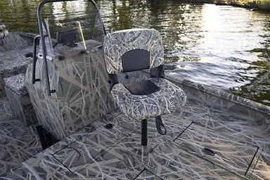 Slide: The Image of Manufacturer Provided Image: Crestliner 1870 Retriever FCC 2026 boat with camouflage seating on a calm lake. - 17