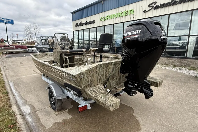 Slide: The Image of 2026 Crestliner 1870 Retriever FCC boat with Mercury engine, parked outside dealership. - 3