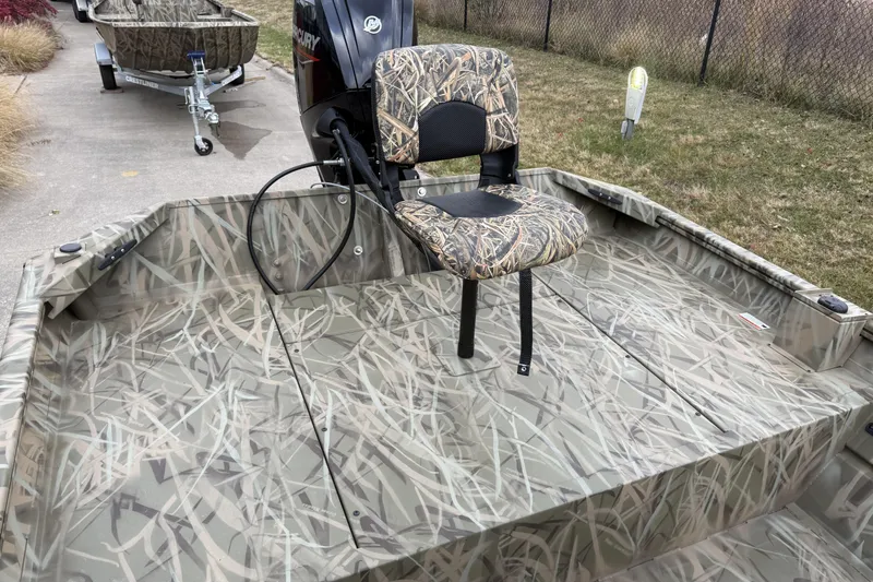 Slide: The Image of 2026 Crestliner 1870 Retriever FCC boat with camo design and Mercury motor. - 5