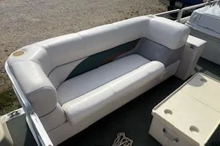 Slide: The Image of 2001 Harris-Kayot Classic 240 O/B boat with white seating and storage compartments. - 6