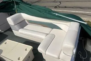 Slide: The Image of 2001 Harris-Kayot Classic 240 O/B boat with white seating and green cover. - 7