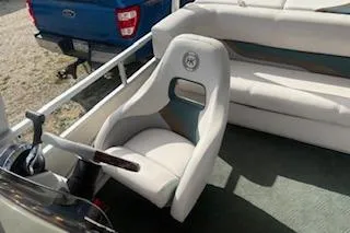 Slide: The Image of 2001 Harris-Kayot Classic 240 O/B boat interior with steering wheel and seating. - 3