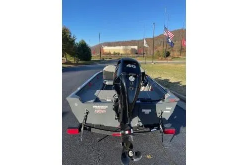 Slide: The Image of 2018 Tracker Super Guide V-16 SC boat with 40 HP motor, parked outdoors. - 3