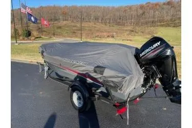 Slide: The Image of 2018 Tracker Super Guide V-16 SC boat with cover and Mercury outboard motor. - 5
