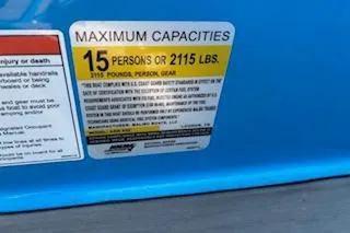 Slide: The Image of 2020 Axis A22 capacity label: 15 persons or 2115 lbs maximum load. - 10