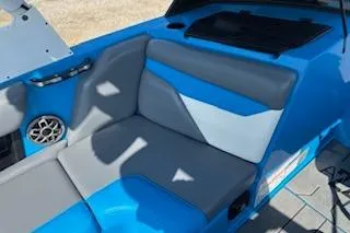 Slide: The Image of 2020 Axis A22 boat interior with blue and gray seating. - 7