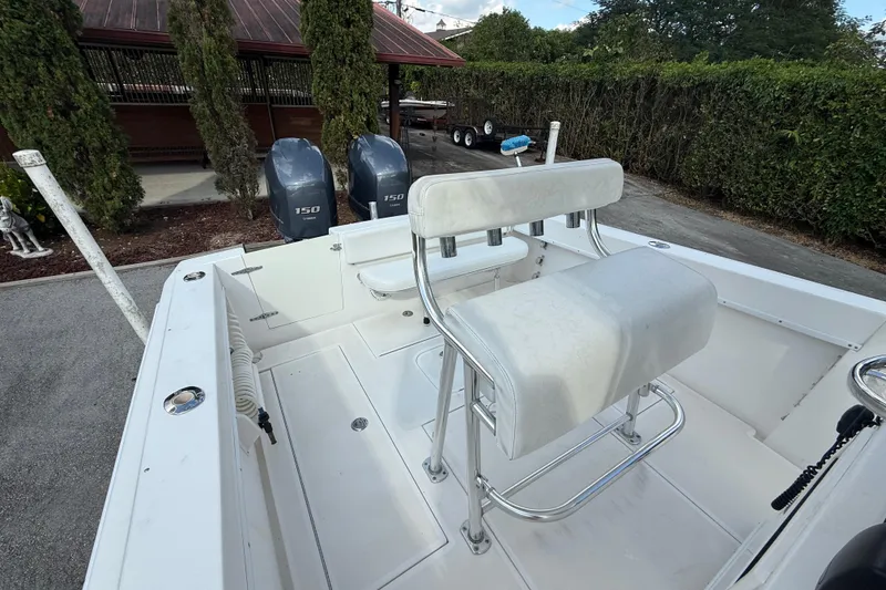 Slide: The Image of 2008 Contender 23 Open boat with dual 150 engines and white seating. - 11
