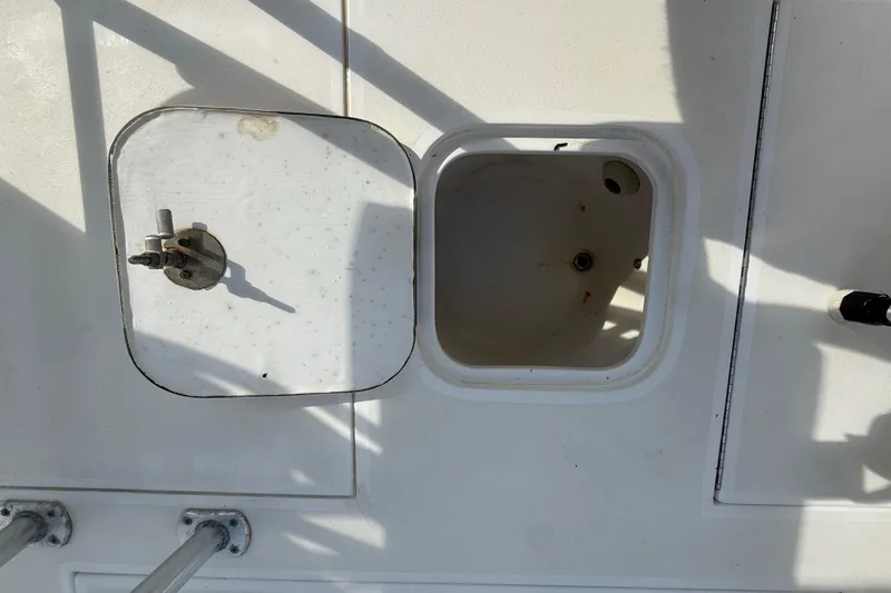 Slide: The Image of Open hatch on 2008 Contender 23 Open boat deck, showing storage compartment. - 16