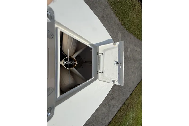 Slide: The Image of Open anchor compartment on 2008 Contender 23 Open boat, showing anchor and storage space. - 20