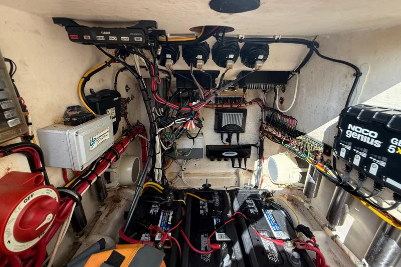 Slide: The Image of Electrical system of a 2008 Contender 23 Open boat, featuring batteries and wiring. - 22