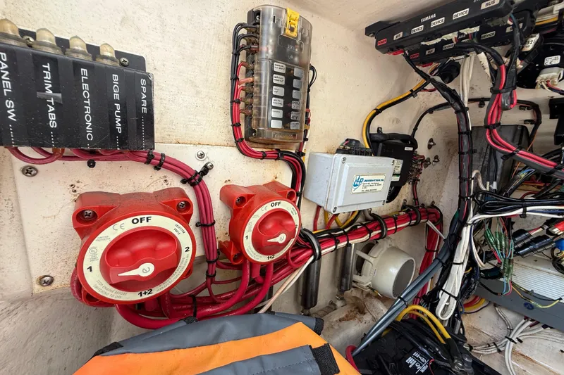 Slide: The Image of Electrical panel and wiring inside a 2008 Contender 23 Open boat. - 24