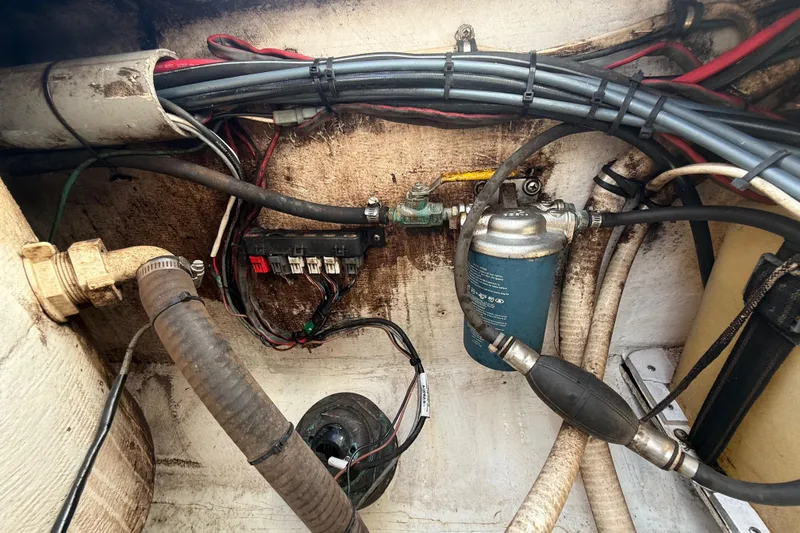 Slide: The Image of Electrical and fuel system components inside a 2008 Contender 23 Open boat. - 26