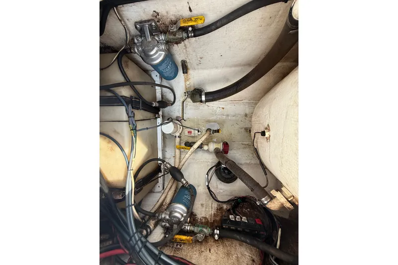 Slide: The Image of Bilge area of 2008 Contender 23 Open boat with hoses and pumps. - 27