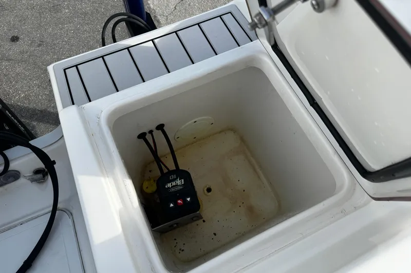 Slide: The Image of Open storage compartment on 2022 Sea Pro 239 Center Console boat. - 10