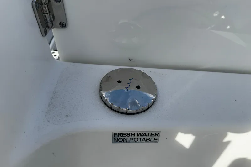 Slide: The Image of 2022 Sea Pro 239 Center Console boat, non-potable fresh water cap detail. - 11