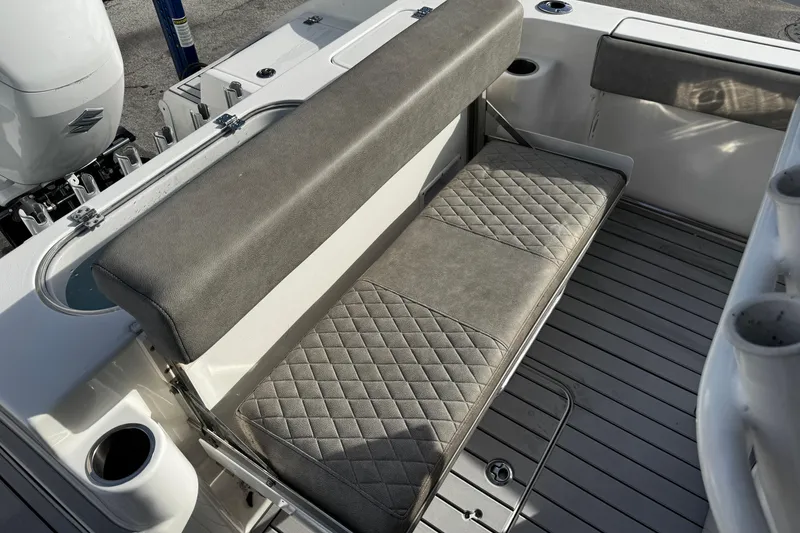 Slide: The Image of 2022 Sea Pro 239 Center Console boat with cushioned seating and sleek design. - 13