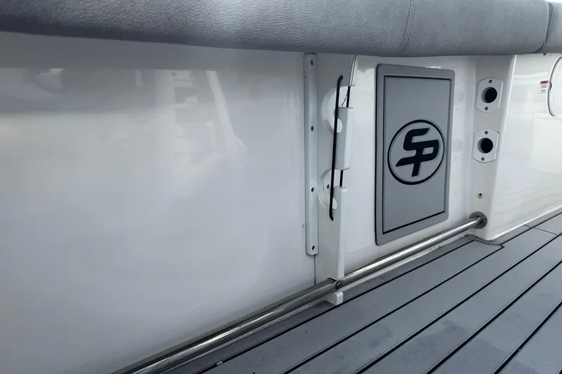 Slide: The Image of 2022 Sea Pro 239 Center Console boat interior with logo and sleek design. - 18