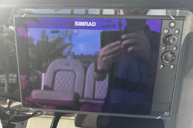 Slide: The Image of Simrad display on 2022 Sea Pro 239 Center Console boat dashboard. - 23