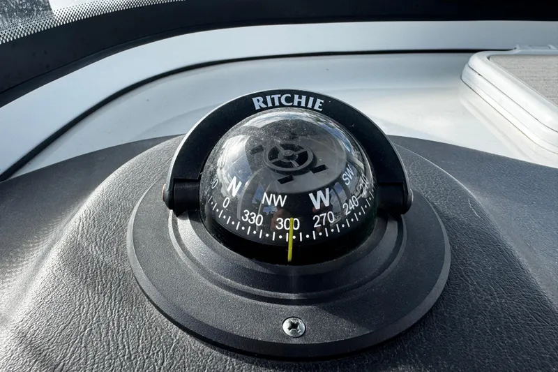 Slide: The Image of Compass on 2022 Sea Pro 239 Center Console boat dashboard. - 31