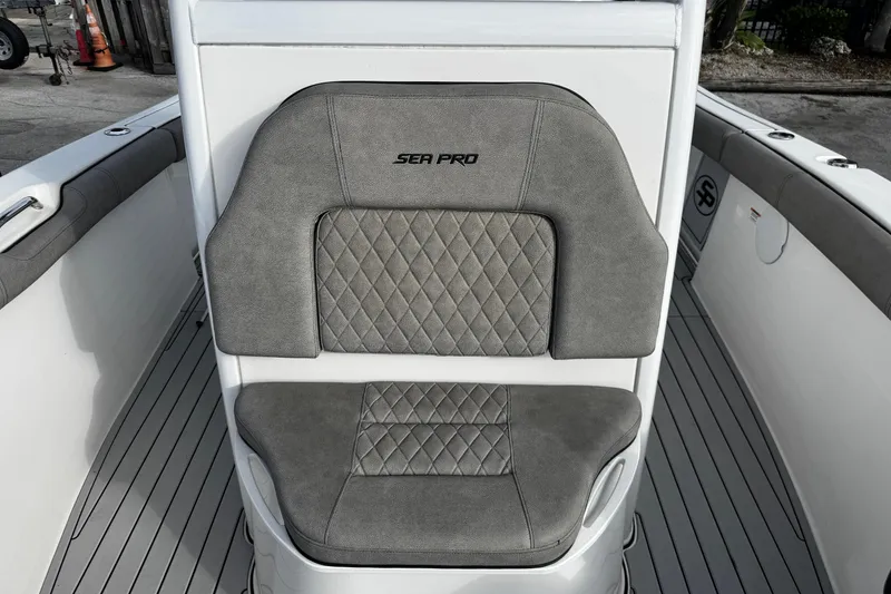 Slide: The Image of 2022 Sea Pro 239 Center Console boat seat with gray diamond-pattern upholstery. - 37