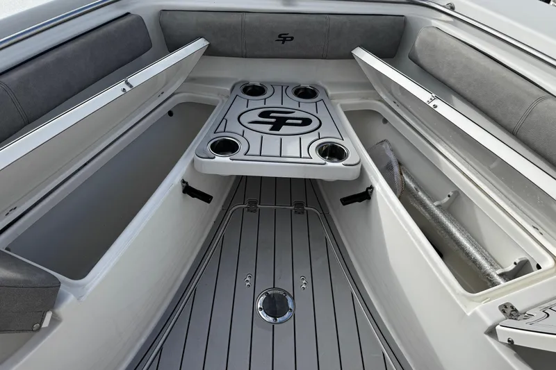 Slide: The Image of 2022 Sea Pro 239 Center Console boat interior with storage compartments and cup holders. - 39