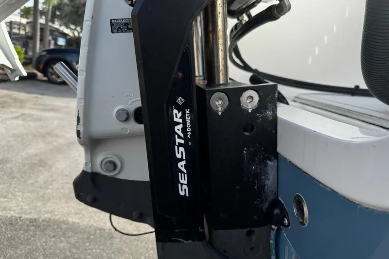 Slide: The Image of Close-up of 2022 Sea Pro 239 Center Console boat with SeaStar hydraulic steering. - 6