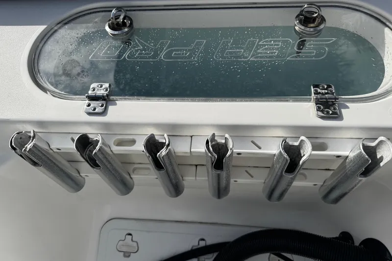 Slide: The Image of 2022 Sea Pro 239 Center Console with rod holders and storage compartment. - 7