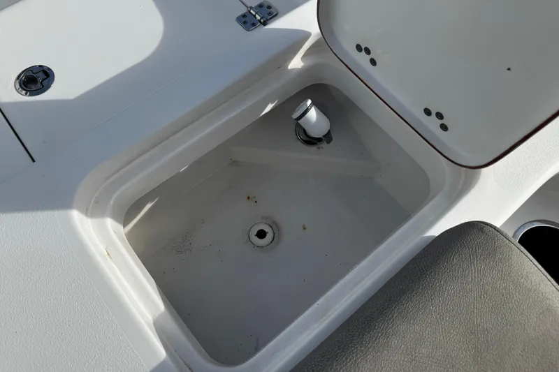 Slide: The Image of Open storage compartment on 2022 Sea Pro 239 Center Console boat. - 9