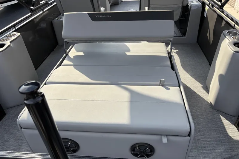 Slide: The Image of 2026 Veranda Relax VR 235 VLI boat interior with convertible seating and cup holders. - 13