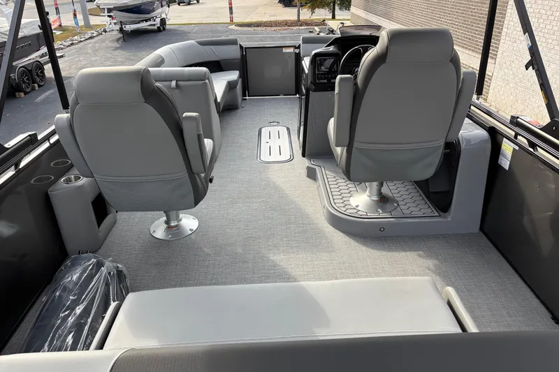 Slide: The Image of 2026 Veranda Relax VR 235 VLI pontoon boat interior with gray seating and helm. - 6