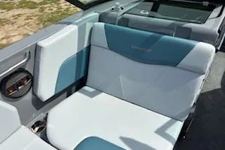 Slide: The Image of 2025 MasterCraft NXT22 boat interior with blue and white seating. - 7