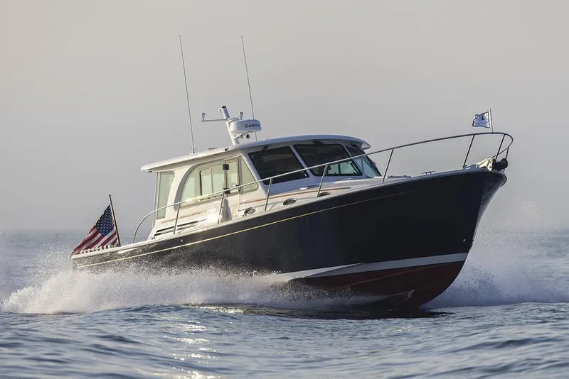 The Image of Manufacturer Provided Image: 2026 Back Cove 412 yacht cruising on open water, American flag displayed. - 0