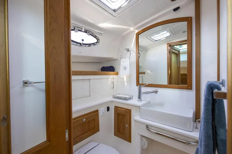 Slide: The Image of Manufacturer Provided Image: Luxurious bathroom in 2026 Back Cove 412 yacht, featuring modern fixtures and wooden accents. - 11