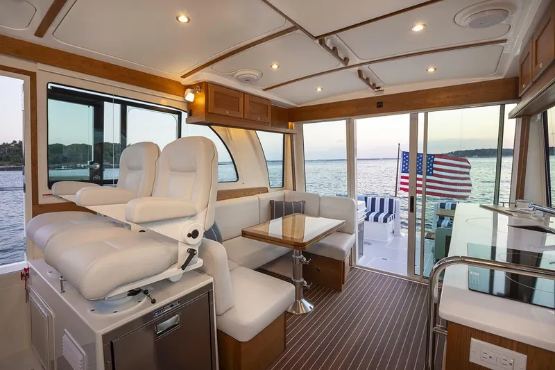 Slide: The Image of Manufacturer Provided Image: Luxurious interior of 2026 Back Cove 412 yacht with ocean view and American flag. - 6