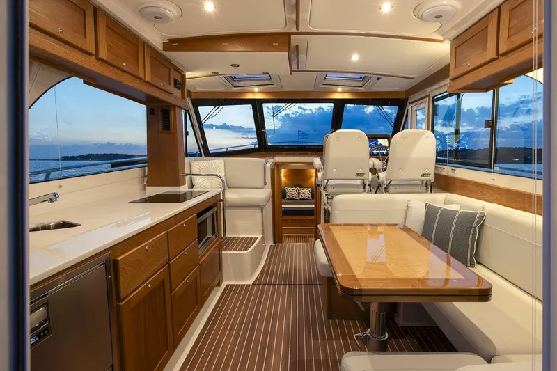 Slide: The Image of Manufacturer Provided Image: Luxurious interior of 2026 Back Cove 412 yacht with modern kitchen and seating area. - 7