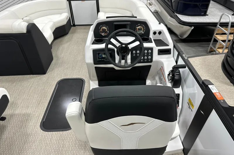 Slide: The Image of Interior of 2026 Evotti 521CS boat with modern steering console and seating. - 11