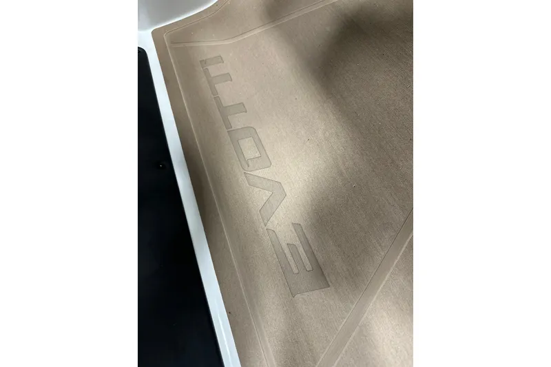 Slide: The Image of Evotti 521CS 2026 model floor mat with embossed logo design. - 13