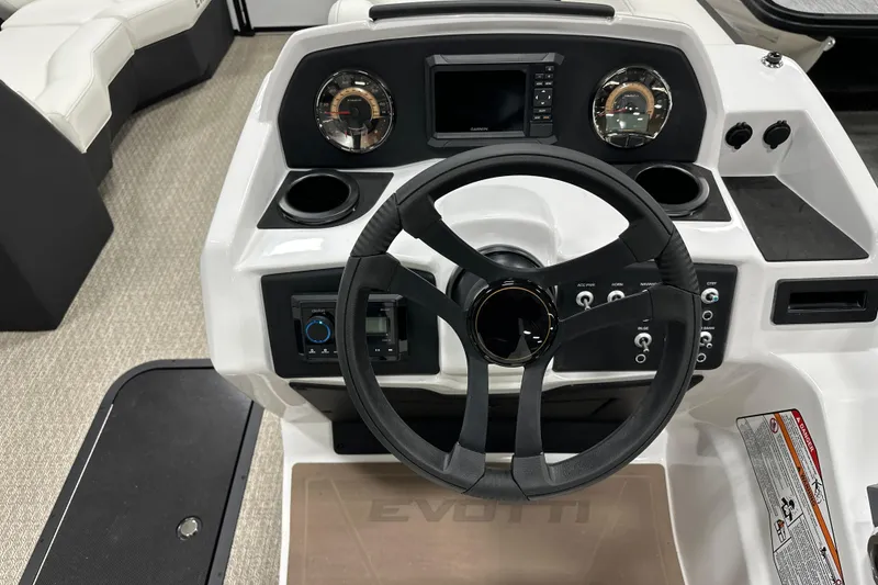 Slide: The Image of Steering console of 2026 Evotti 521CS boat with modern controls and dashboard. - 14
