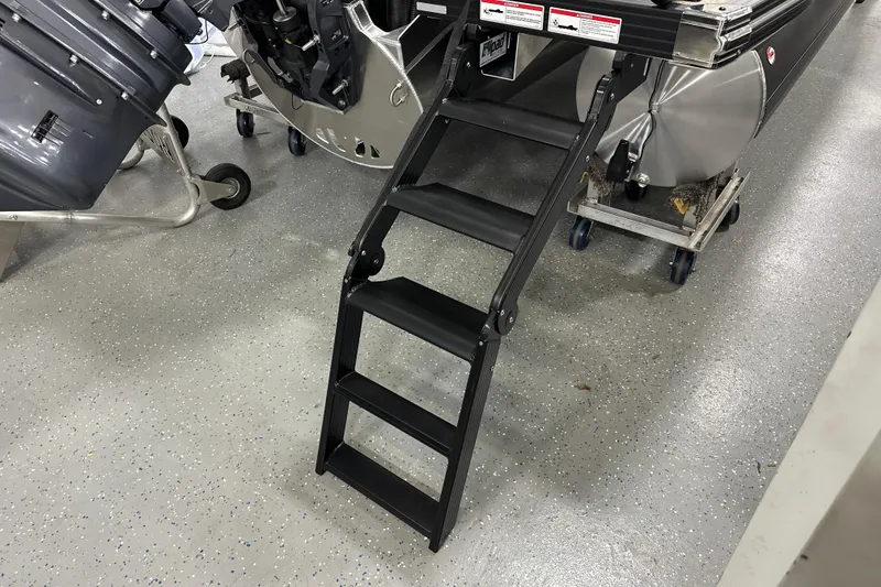 Slide: The Image of Evotti 521CS 2026 model with foldable black ladder on speckled garage floor. - 22