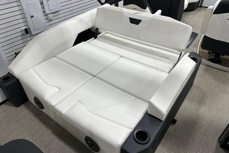 Slide: The Image of Evotti 521CS 2026 boat interior with white cushioned seating and cup holders. - 5