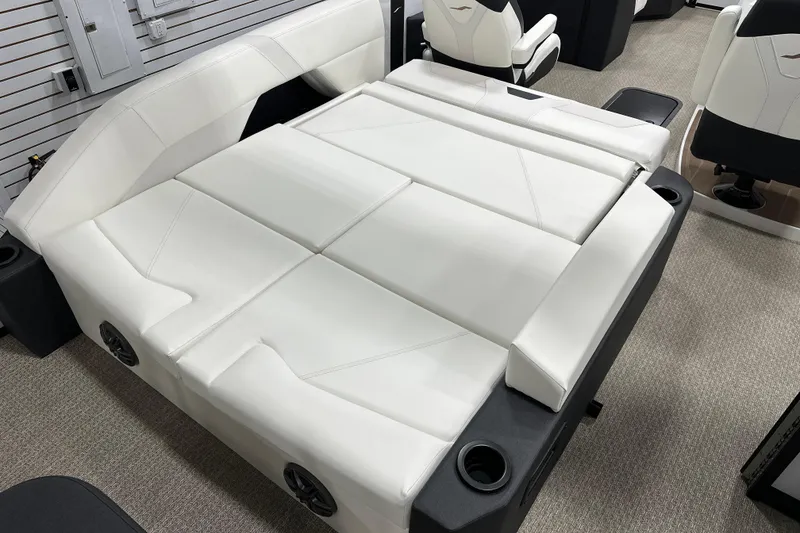Slide: The Image of Luxurious white seating in 2026 Evotti 521CS boat, featuring integrated cup holders and speakers. - 6