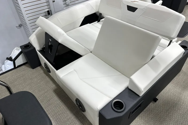 Slide: The Image of Luxurious white seating in 2026 Evotti 521CS boat, featuring cup holders and modern design. - 9