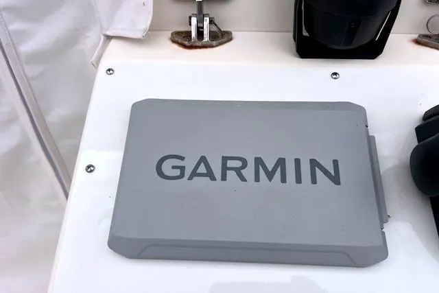 Slide: The Image of Garmin device on 2005 Parker 2320 SL Sport Cabin boat dashboard. - 9