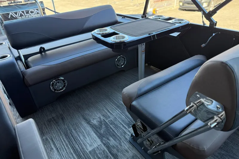 Slide: The Image of Interior of 2026 Avalon 2585 LSZ Entertainer with seating and table setup. - 10