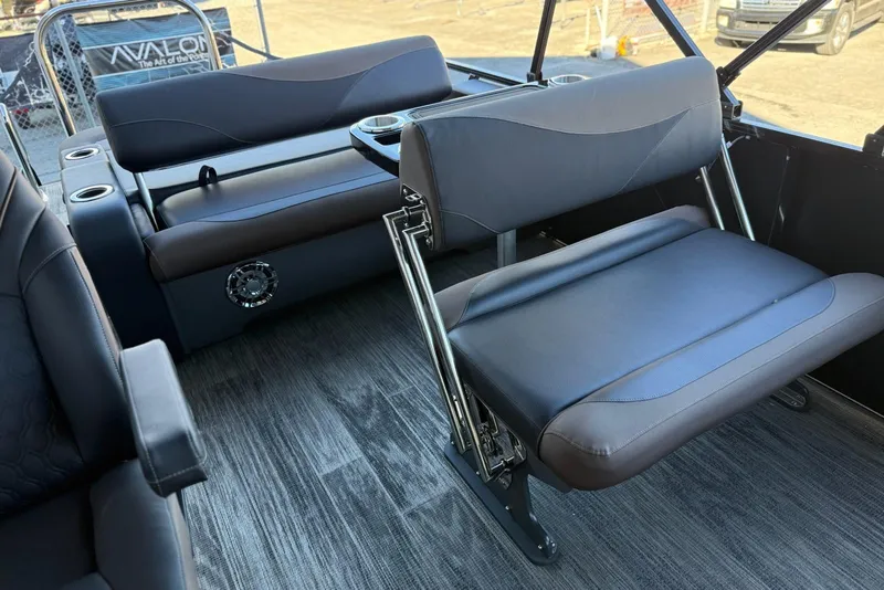 Slide: The Image of Interior of 2026 Avalon 2585 LSZ Entertainer boat with modern seating and flooring. - 11